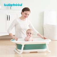 Mom with baby in Babyhood Blue Folding Bath Tub