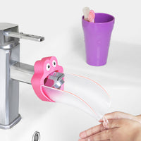 Babyhood Pink Water Chute Faucet Extender on a faucet