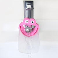 Babyhood Pink Water Chute Faucet Extender on a faucet
